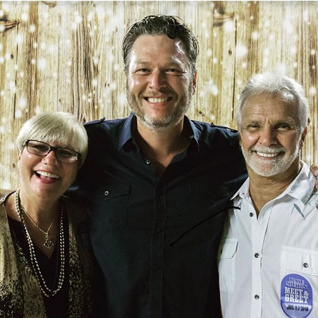 He's a little bit country too. Blake Shelton gives a huge smile with the Rosbachs.